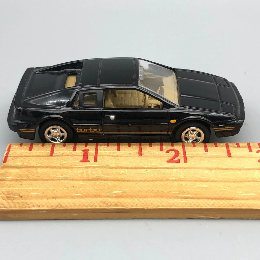Johnny Lightning 1977 Lotus Esprit Turbo S1 Diecast Car Black Diecast 1/64 Scale